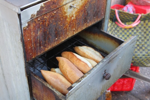 banh mi heated over coals